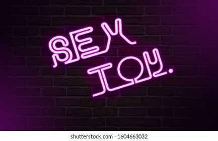 Blurred Background Neon Sign, The Word SEX TOY On Dark Background. Design Element For Happy Valentine's Day. Ready For Your Design, Greeting Card, Banner.