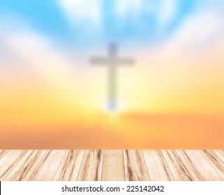 Blurred the cross on a sunset and wooden paving - Powered by Shutterstock