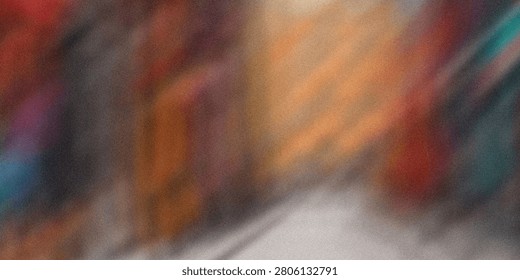 Blurred vibrant abstract background featuring diagonal streaks and a grainy texture, creating dynamic multicolored motion, ideal for energetic modern designs.