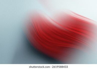 A blurry close up shot of a red object against a light blue and white gradient background texture element