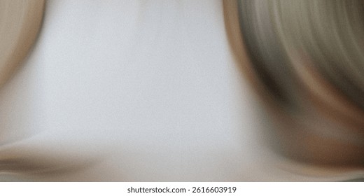 A blurry close up of two objects with one appearing to be brown and the other appearing to be beige