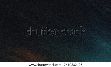 A blurry dark background with a gradient of blue and green colors blending into the black space around it