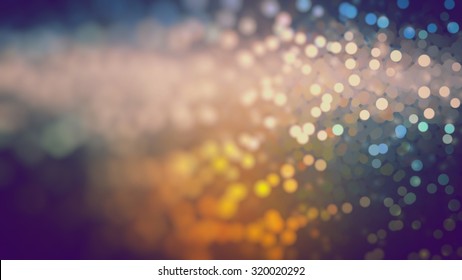 Bokeh light, shimmering blur spot lights on multicolored abstract background.
