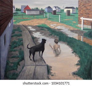 A Boy And His Dog Play In A Puddle In Yorkton, Saskatchewan, 1950s.  Retro Scene Of Suburban Family Life.  Small Houses And Water Tower In Background.