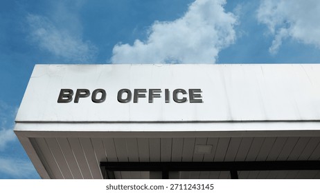 BPO Office sign on a commercial building under blue sky, symbolizing Business Process Outsourcing, corporate services, offshore operations, call center, and administrative support