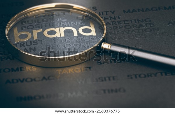 Brand marketing and management, branding or\
rebranding concept. 3d illustration of a magnifying glass over\
golden and black\
words.