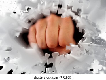 Breaking puzzle by knocking it to pieces. Photo-based graphic compositing.