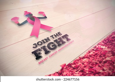 Breast cancer awareness message against autumn leaves against white wood - Powered by Shutterstock