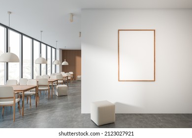 Bright Cafe Interior With Empty White Poster, Panoramic Window With Town View, Tables With Chairs, Pouf And Concrete Floor. Concept Of Minimalist Design. Space For Creative Idea. Mock Up. 3d Rendering