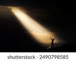 A bright light shines through the clouds and a person praying, shouting and appealing to God, pain, sadness, despair and trials concept.
