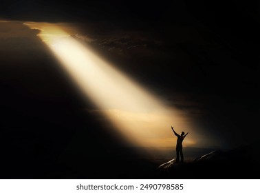 A bright light shines through the clouds and a person praying, shouting and appealing to God, pain, sadness, despair and trials concept.
