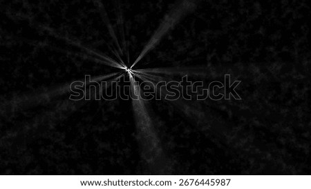 Bright white light rays emanating from a central point against a
