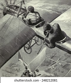 British Two-seater Monoplane Fires On A WW1 German Taube Fighter. 1914-15. A Rifle Is Used To Shoot The Pilot Of The German Plane.