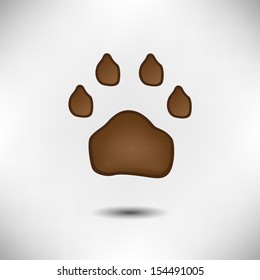 Brown animal paw. Isolated on white background.