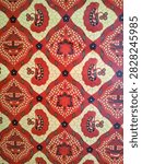 a brown bckground with a beaitiful batik pattern typical of javanese, Indonesia. 