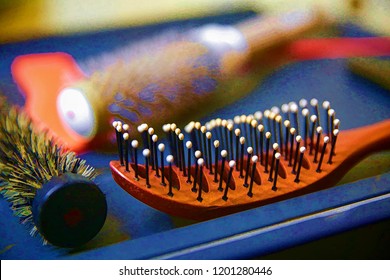 Brushes And Combs For Hair On The Table At The Hairdresser.The Picture Is Made Using A Filter On Photoshop.