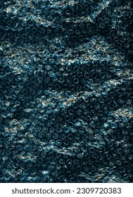 Bubble wrap texture. Grunge background. Crinkled noise. Blue orange black color wrinkled uneven old plastic film on dark illustration abstract wallpaper.