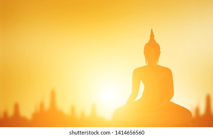Buddha statue, Silhouette Buddha on golden sunset background, Concept of important days in Buddhism, Visakha Puja Day
