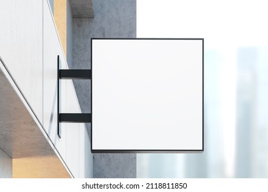 Building Exterior With Blank Square Light Box Sign Mounted Outdoor, Front View, Concrete Wall. Business Skyscrapers On Background Blurred. Mockup Copy Space, 3D Rendering