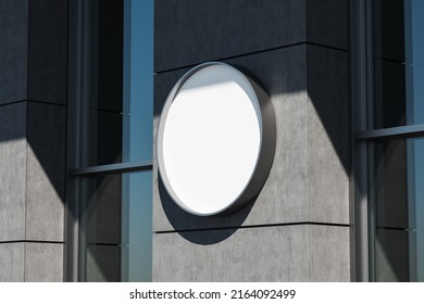 Building Exterior With Empty Round Light Box Mounted On Grey Tile Outdoor, Side View. Mockup Copy Space, 3D Rendering