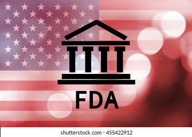 Building Icon With Inscription FDA And Flag Of The United States Over Abstract Background.