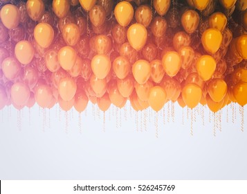 Bunch of celebration orange balloons isolated on white background 