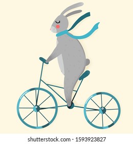 Bunny in a scarf rides a bicycle 
