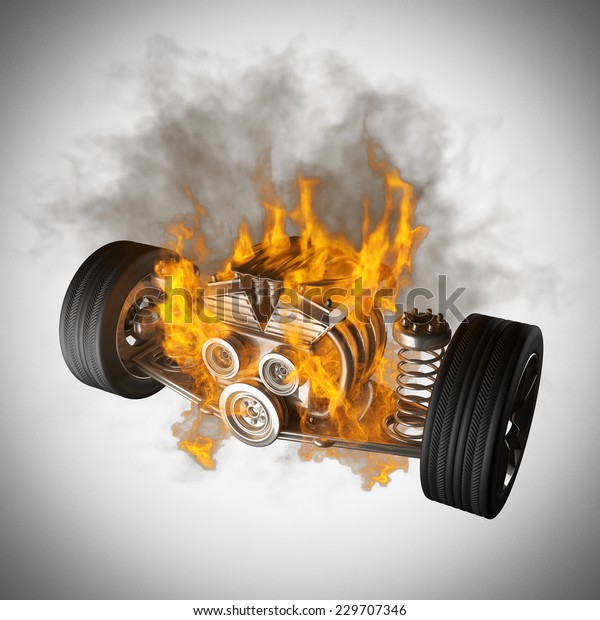 burning car chassis\
with engine and\
wheels