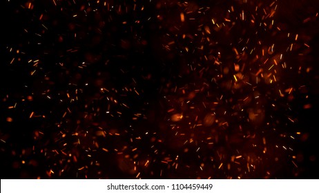 Burning Red Hot Sparks Fly From Large Fire In The Night Sky. Beautiful Abstract Background On The Theme Of Fire, Light And Life. Burning Embers Glowing Flying Away Particles Over Black Background.