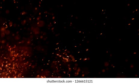 Burning Red Hot Sparks Fly From Large Fire In The Night Sky. Beautiful Abstract Background On The Theme Of Fire, Light And Life. Burning Embers Glowing Flying Away Particles Over Black Background.