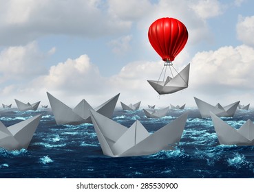 Business advantage concept and game changer symbol as an ocean with a crowd of paper boats and one boat rises above the rest with a red balloon as a success and innovation metaphor for new thinking.