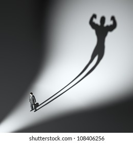 Business Man Casting A Shadow Of An Athlete - Business And Career Strength Concept