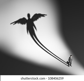 Business man casting a winged silhouette shadow - Powered by Shutterstock