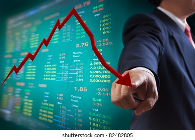 Business Man Point To Falling Graph Of Stock Market