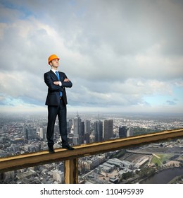 Business Man Standing High Over A Cityscape