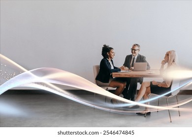 Business meeting diverse team. African American woman, Caucasian man, and Caucasian woman in professional attire. Team collaboration and business meeting strategy discussion. - Powered by Shutterstock