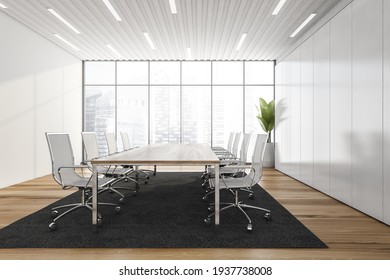 Business Meeting Room With White Armchairs And Wooden Table, Black Carpet On Parquet Floor. White Long Shelf And Plant Near Window With City View, 3D Rendering No People