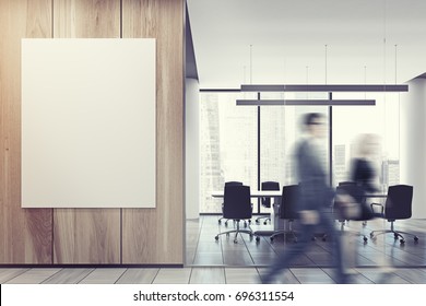 Business People In An Office Lobby With A Glass And Wooden Walls, A Vertical Poster And An Open Office Environment With White Computer Tables And Loft Windows. 3d Rendering Mock Up