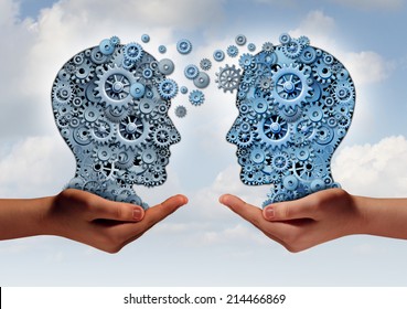 Business Technology Concept As Two Hands Holding A Group Of  Machine Gears Shaped As A Human Head As A Symbol And Metaphor For The Transfer Of Industry Information Or Corporate Training.