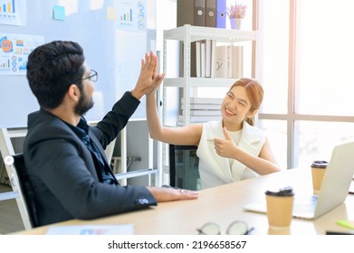 Businessman And Businesswoman Giving Hi Five Or Touching Hands And Thumb Up At Modern Office. Business Union And Success Concept