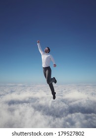 Businessman Hero Flying Over Clouds