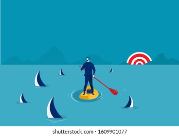 businessman paddle boarding in the suit with island surrounded by sharks.  , stand up paddle forward to success concept  - Powered by Shutterstock