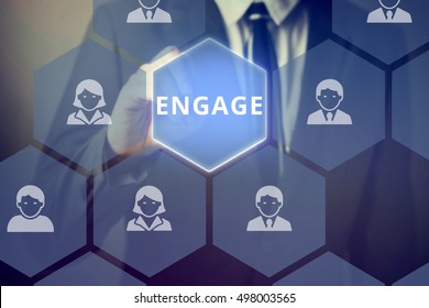 Businessman touching 'ENGAGE' word on virtual screen - can indicate customer engagement and marketing