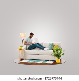 Businessman working on laptop computer sitting on a couch at his home office. Studying, freelance and home office concept. Unusual 3d illustration