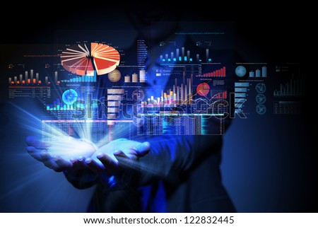 Businesswoman with financial symbols coming from her hand