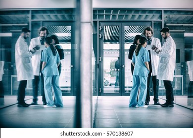 Businesswoman interacting with doctors in hospital - Powered by Shutterstock