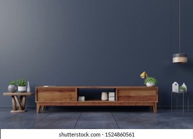 Cabinet TV In Empty Interior Room ,dark Wall With Wood Shelf,lamp ,plants And Table Wood ,3d Rendering