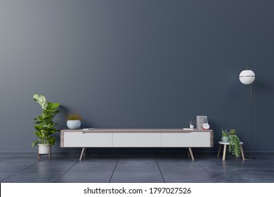 Cabinet TV In Empty Interior Room ,dark Wall With Wood Shelf,lamp ,plants And Table Wood ,3d Rendering