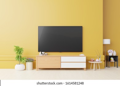 Cabinet Tv And Yellow Wall In Living Room.3d Rendering