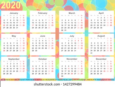 Calendar 2020 background with colorful circles, each month on white squares and with public holidays for the USA